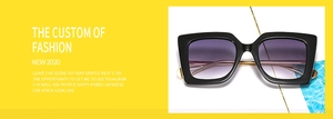 Detail of stylish oversized square sunglasses with black frame and purple gradient lenses