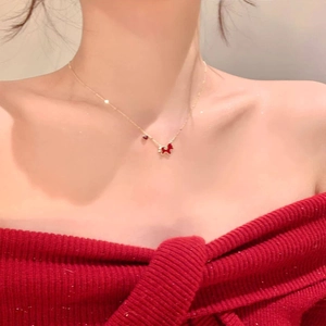 Gold plated necklace with red acetate Scottish Terrier puppy pendant on collarbone