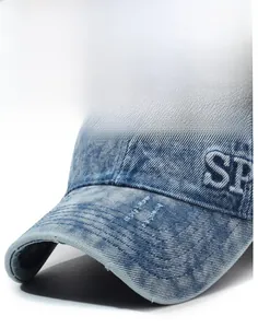 Detail of distressed denim baseball cap with 3D SP embroidery and reinforced brim