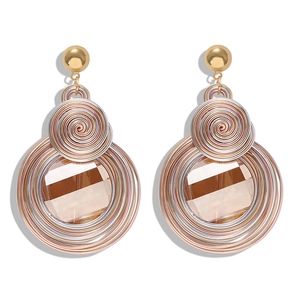 Macro detail of bohemian wire-wrapped heart earrings with brown square gemstones