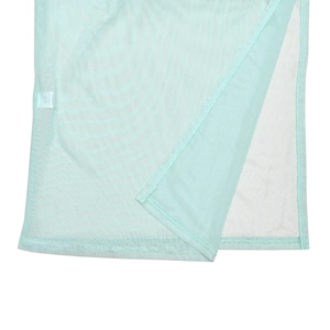 Detail view of light blue mesh fabric texture and hemline stitching on women's dress