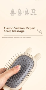 Close-up of rabbit ear massage hairbrush with soft cushion for wet and dry hair