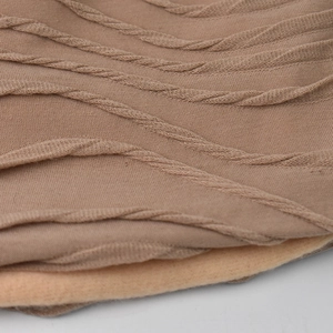Close-up of the breathable knitted lace texture and soft fleece lining for warm comfort
