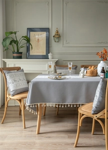 Close-up of jacquard reindeer and Christmas tree patterns on festive grey napkins and pillows