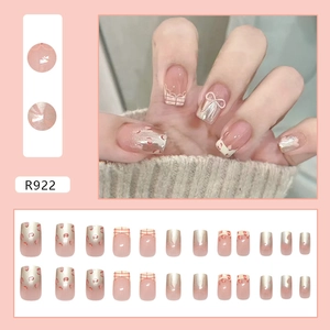 Pink French press-on nails with bow designs, leopard print, and gold accents (24 pieces)