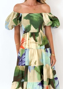 Detail of tropical print off-shoulder dress with elastic smocking and tiered skirt