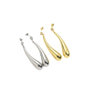 Polished gold and silver teardrop earrings with elegant stones on a white background