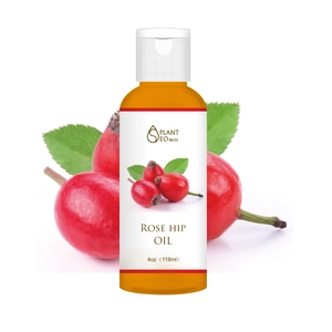 Natural Rose Hip Oil 118ml with organic rose hips and green leaves on white background