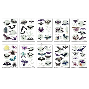 Set of 10 luminous Halloween temporary tattoos featuring cartoon bats and webs on white back