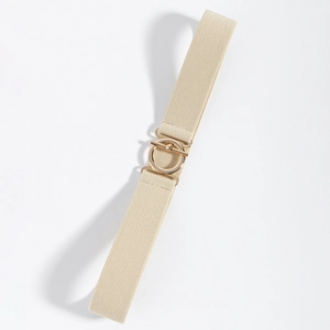 Detail of beige elastic woven belt with a gold round metal buckle on white background