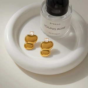 Elegant gold-plated stainless steel stud earrings with zircons in a luxury setting