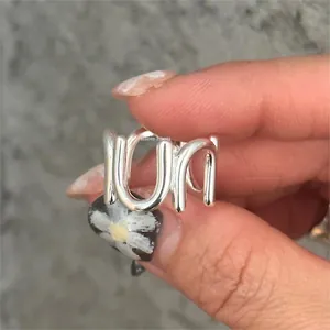 Macro shot of silver S925 sterling silver ring with unique wavy multilayer wrap design