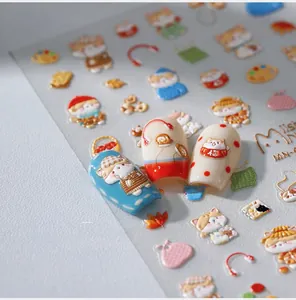 Macro view of 3D embossed nail stickers featuring cute cartoon cats and artistic motifs