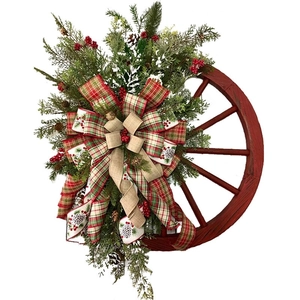 Christmas wreath with red wooden wheel, pine cones and rustic burlap bow decoration