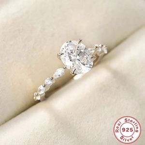 Macro shot of oval cut diamond ring in 925 sterling silver with Real 925 certification seal