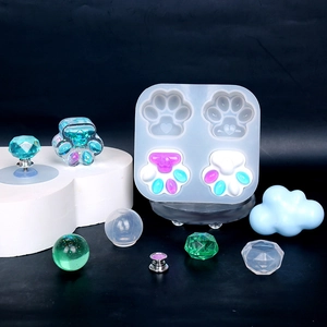 Macro detail of cat paw resin mold and crystal drawer handle crafts with glitter finish