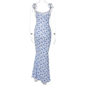Back view of summer floral sundress with blue flower pattern and fisheye hem on mannequin
