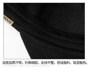Detail of widening sweatband and SPORT metal tag on cotton baseball cap