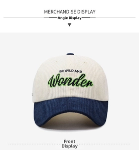 Detailed view of corduroy baseball cap with Wonder embroidery and contrast navy blue brim