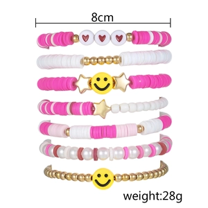 Detail of 7-piece bohemian bead bracelet set with smiley face charms and pearls