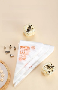 Macro view of thickened disposable piping bags with stainless steel nozzles for cake baking