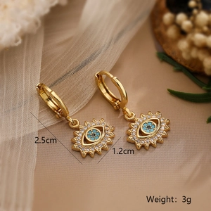 Detail shot of 18K gold evil eye earrings with dimensions 2.5cm by 1.2cm and 3g weight