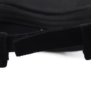 Macro detail of the adjustable black woven strap and stitching on the studded sun hat