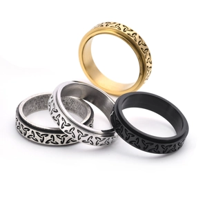 Vintage Celtic knot spinner rings in gold, silver, and black stainless steel for men