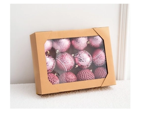 Pink Christmas ornaments with diverse textures in a windowed kraft paper gift box