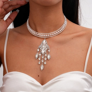 Detail of luxury multi-layer choker necklace with pearls, rhinestones, and tassel pendant