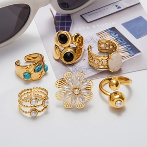 Golden stainless steel rings set with natural turquoise pearls and black stones