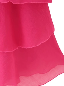 Detailed view of pink layered ruffles and chiffon fabric edges on a summer dress