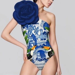 One-shoulder swimsuit with 3D blue flower detail and blue porcelain toucan print