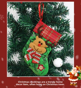 Detail of green Christmas stocking featuring a 3D reindeer design on a Christmas tree