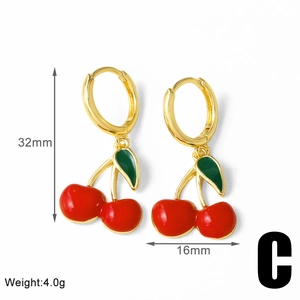Detailed view of red cherry earrings with gold hoop measuring 32mm by 16mm
