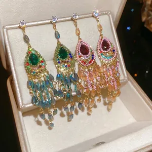 Vintage crystal teardrop tassel earrings with sparkling rhinestones and silver pins
