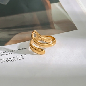 Elegant gold layered wavy ring with liquid metal texture and high polished mirror finish