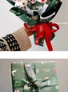 Detail of Christmas ribbon with gold Merry Christmas lettering and snowflake patterns