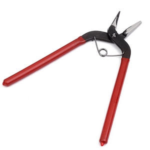 Detail view of red spring-loaded diagonal pliers showing black sharp cutting jaws