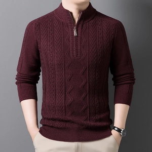 Close-up of wine red cable knit sweater featuring a premium metal half-zip neckline