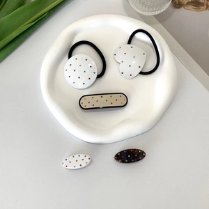 Polka dot hair accessories set with acetate clips and scrunchies in minimalist style