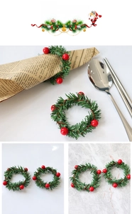Detailed view of Christmas napkin ring featuring festive red berries and pine needles