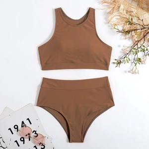 Brown two-piece high-waisted swimsuit with tank top and bikini bottom on white background