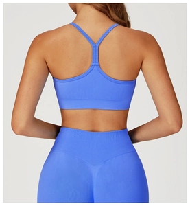Detail view of seamless bright blue yoga set featuring a supportive racerback sports bra