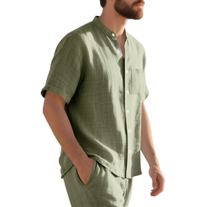 Detail of men's linen short sleeve shirt with stand collar and pocket in sage green