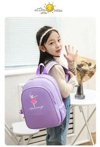 Detail of purple nylon backpack featuring a ballet dancer and 'Dancing' text