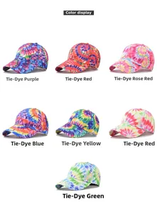 Detail view of cotton baseball caps with colorful graffiti patterns and tie-dye designs