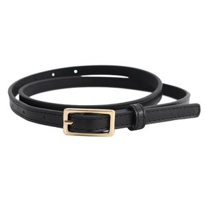 Minimalist black leather skinny belt with a polished gold rectangular buckle on white backdrop