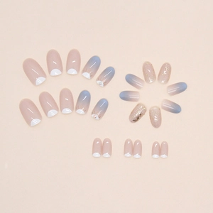 Blue and pink gradient press-on nails with oval shape, gold foil, and glitter diamond accents