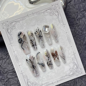Handmade long trapezoid press-on nails with black snake, butterfly art, and large rhinestone
